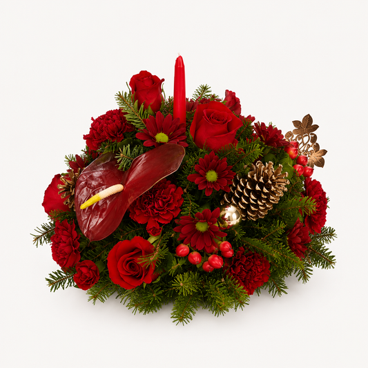 Candlelight Christmas red holiday flower centerpiece with roses and seasonal greenery