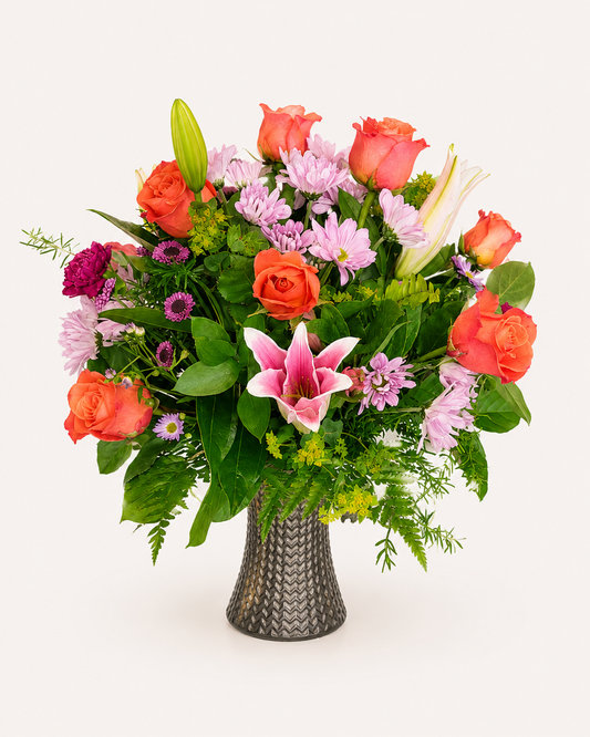 Coral Kiss romantic floral arrangement in coral and pink tones
