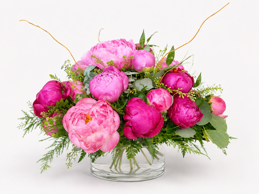 Peony Perfection arrangement with premium pink peonies and greenery in glass vase