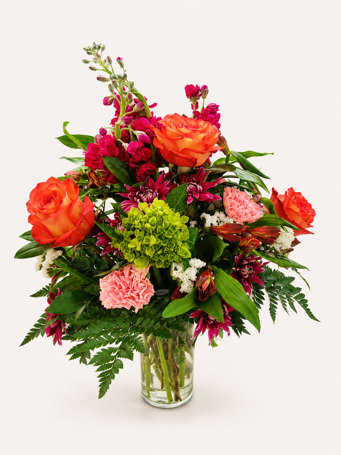 Coral Reverie colorful mixed floral arrangement in coral and burgundy tones