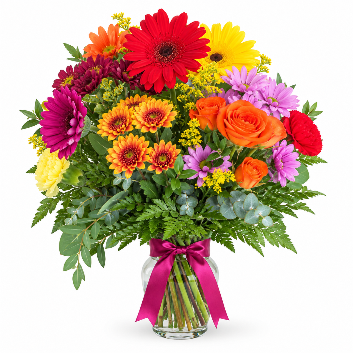 Colorful Rainbow flower arrangement with red, orange, yellow, purple and pink blooms arranged with greenery in a clear glass vase.