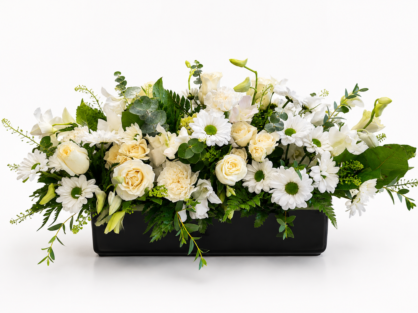 Serene Elegance all-white horizontal floral arrangement with greenery